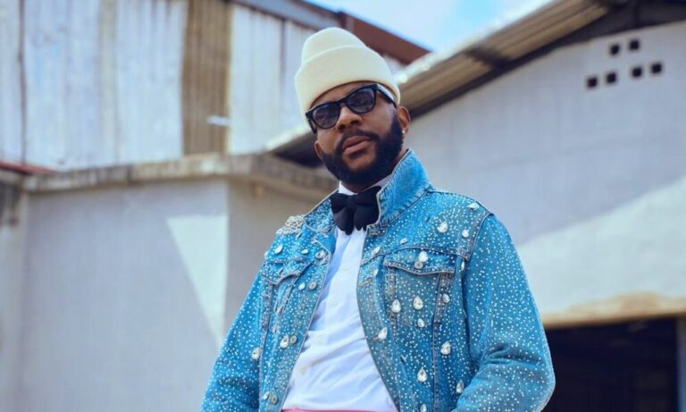 Big Brother Naija host Ebuka Obi-Uchendu wearing a crystal-embellished denim jacket and pink wide-leg trousers by ATAFO