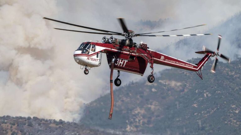 A Sikorsky S-64 Skycrane approaches to refill as crews fight the Widemouth 2 Fire east of Fillmore on Tuesday. Federal