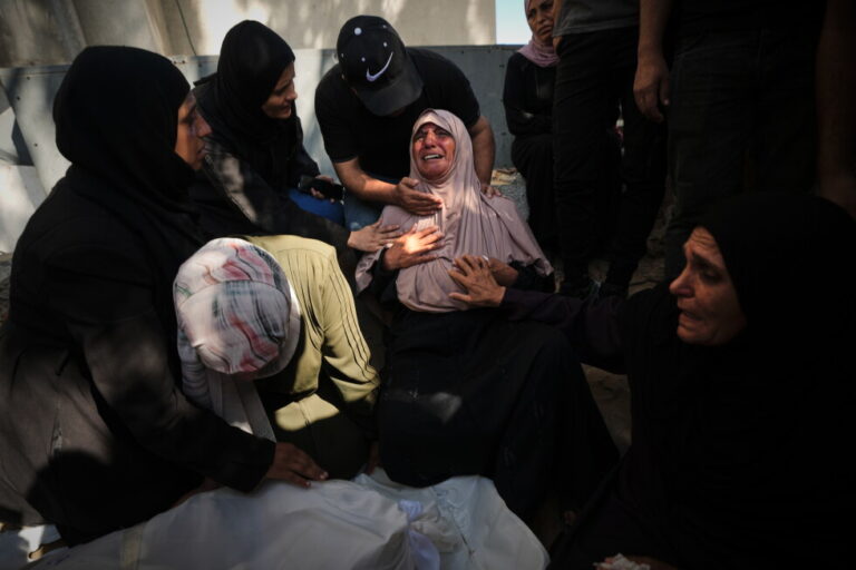 Mourners attend the funeral of Palestinians who were killed in an Israeli army strike on a cafe at the Gaza port the