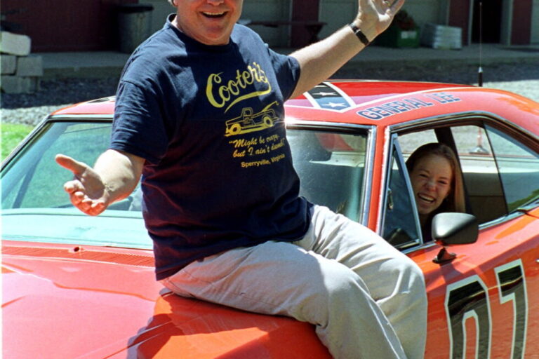 Cooter, actor Ben Jones, sits atop one of the 229 hotrods, named the General Lee, used in the show "Dukes of Hazzard" as
