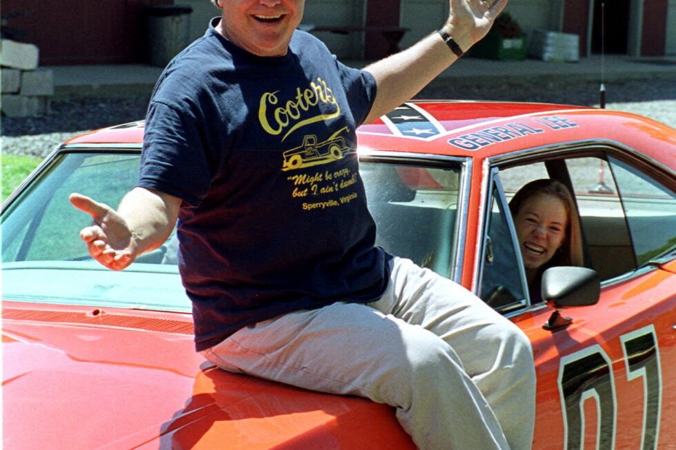 Cooter, actor Ben Jones, sits atop one of the 229 hotrods, named the General Lee, used in the show "Dukes of Hazzard" as