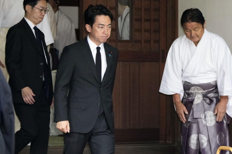 Japan's Defense Minister Shinjiro Koizumi, center, visits Yasukuni Shrine in Tokyo, Saturday, Aug. 15, 2026. (Kyodo News via