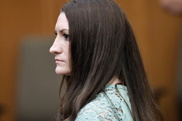 Lindsay Clancy watches jurors as they enter the courtroom to start their second day of deliberations in her murder trial at
