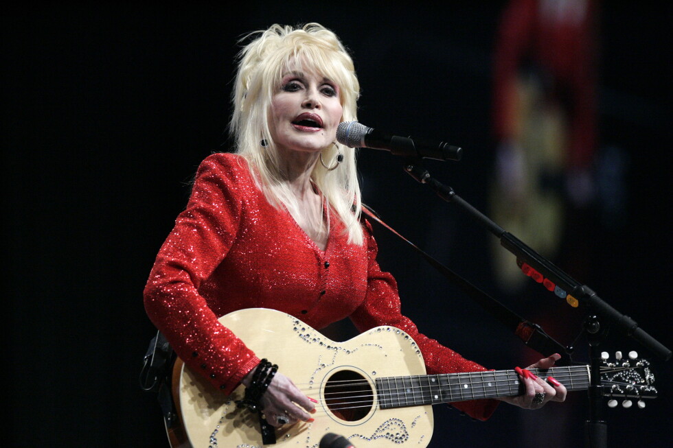 Dolly Parton performs at a United Way of America convention in Detroit, Friday, May 15, 2009. (AP Photo/Carlos Osorio, File)