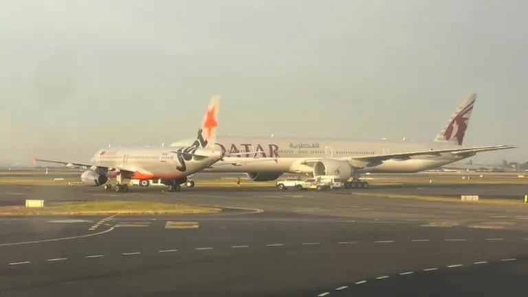 Two planes have near-miss at Sydney Airport, crew member injured