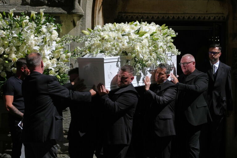 The coffin is taken from Swansea Minster following the funeral of Bonnie Tyler in Swansea, Wales, Monday, Aug. 17, 2026. (AP