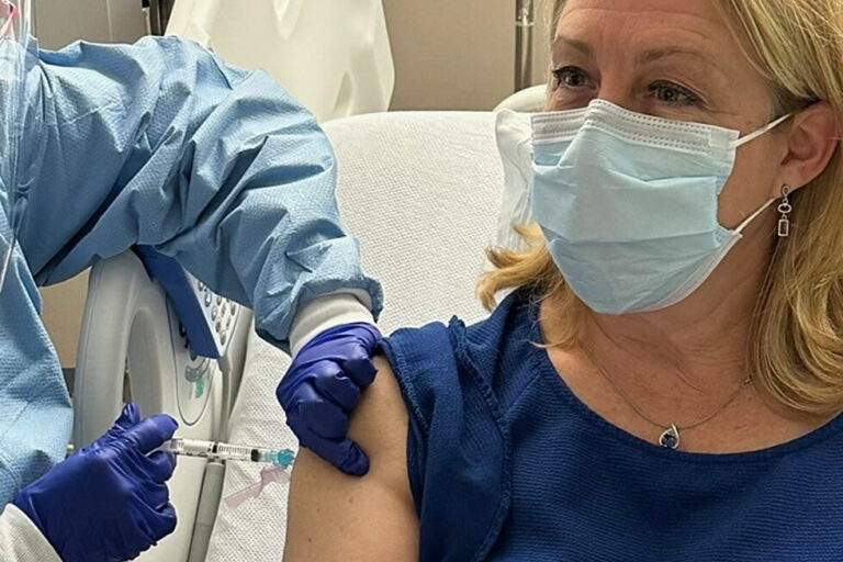 In this photo provided by Dr. Stacy Norton, she receives a trial vaccine for Lynch Syndrome at the MD Anderson Cancer Center