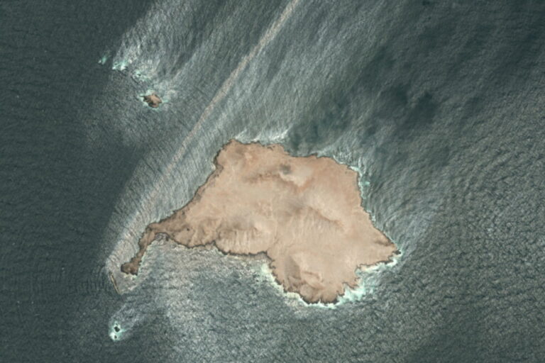 This satellite photo taken Wednesday Aug. 5, 2026, shows the tanker Caroline Bezengi, grounded and partly submerged off the