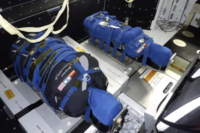 Preflight photograph inside the Artemis I Orion spacecraft. The mannequin on the left, Zohar, is wearing the vest. Helga, on