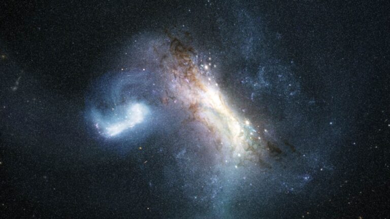 A bunch of white, blue and brownish swirls against a dot-speckled section of space