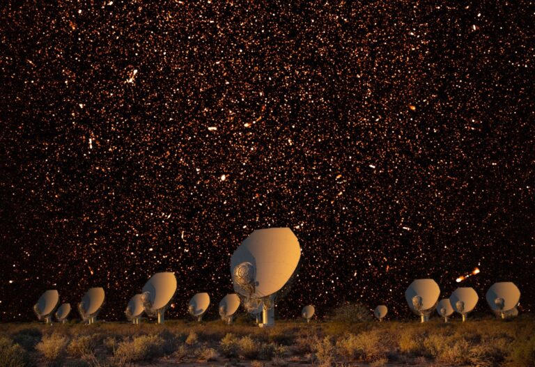The MeerKAT array at night in South Africa, with bright radio sources represented in the night sky. Credit: SARAO