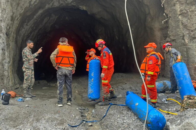 This photo provided by the Nepal Army, shows Nepal army soldiers undertake rescue operation at the site of a hydropower