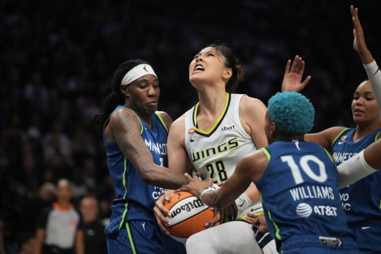 Minnesota Lynx forward Natasha Howard (1) forces a jump ball with Dallas Wings center Li Yueru (28) in the second half of an
