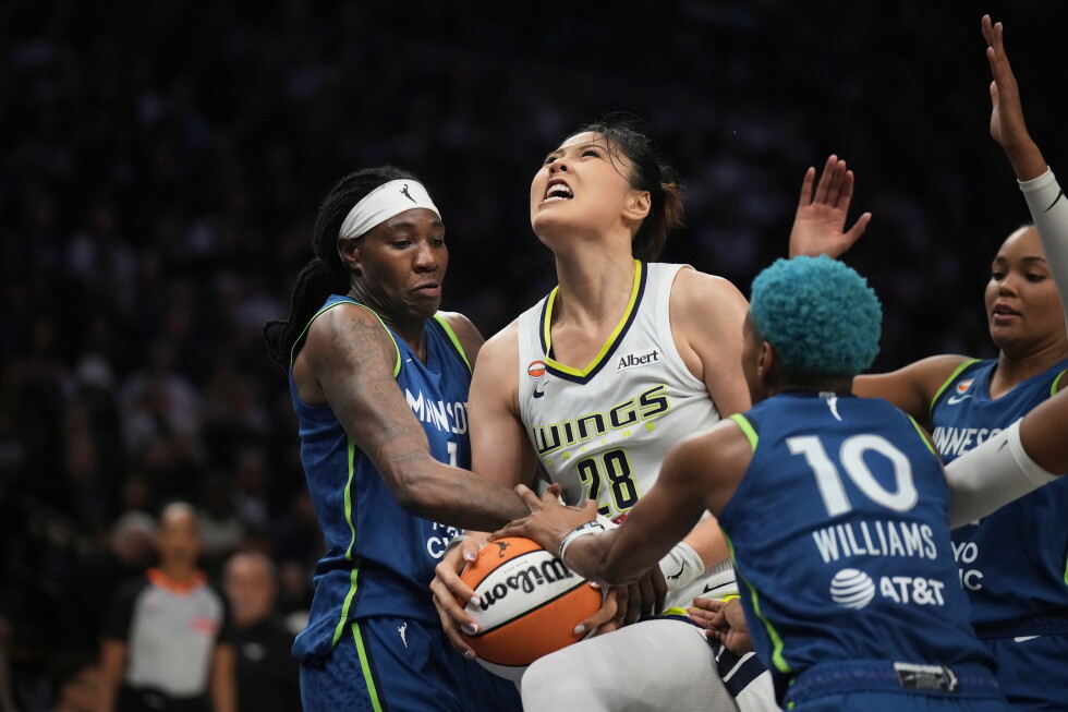 Minnesota Lynx forward Natasha Howard (1) forces a jump ball with Dallas Wings center Li Yueru (28) in the second half of an
