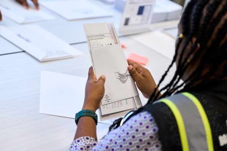 Wake County Board of Elections employees prepare absentee ballots to be mailed on Thursday, Sept. 3, 2026, in Raleigh, N.C