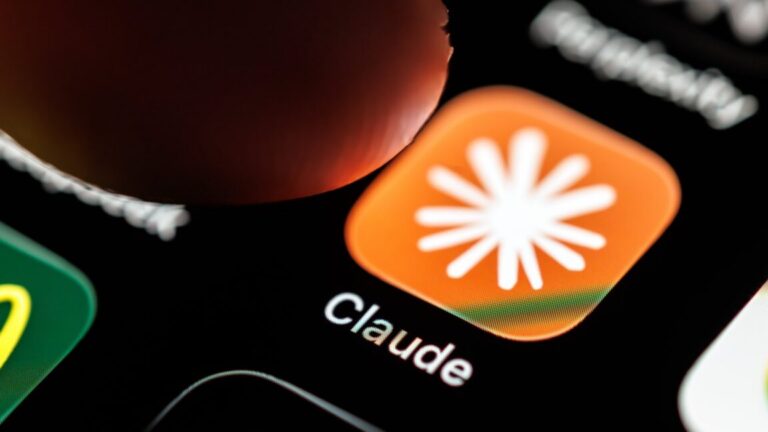 A person's finger hovering over the Claude AI app's icon on a phone screen