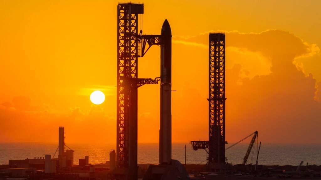 A towering SpaceX Starship rocket stands at Starbase