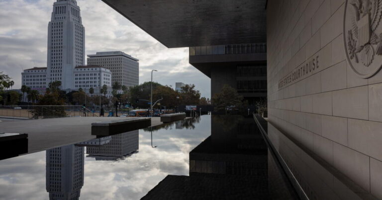 Los Angeles, CA - November 07: A view of City Hall and its reflection, from the United States Courthouse, also known as the