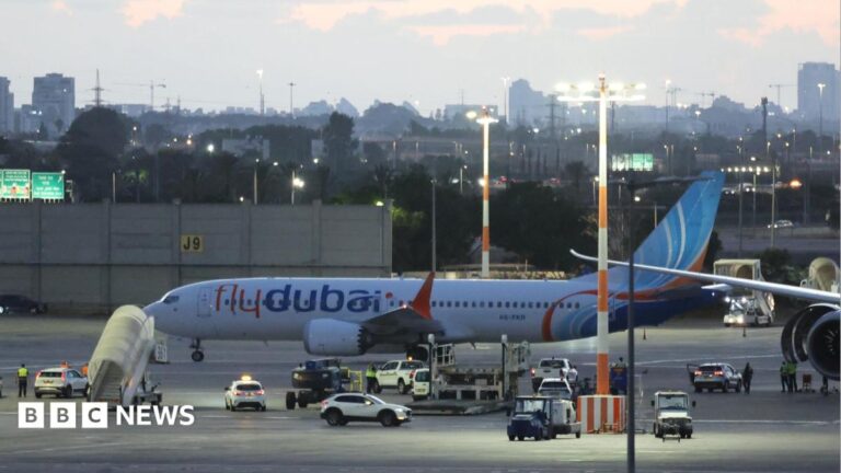 A Flydubai aircraft carrying passengers from Tabuk, Saudi Arabia, stands on the tarmac after landing at Ben Gurion