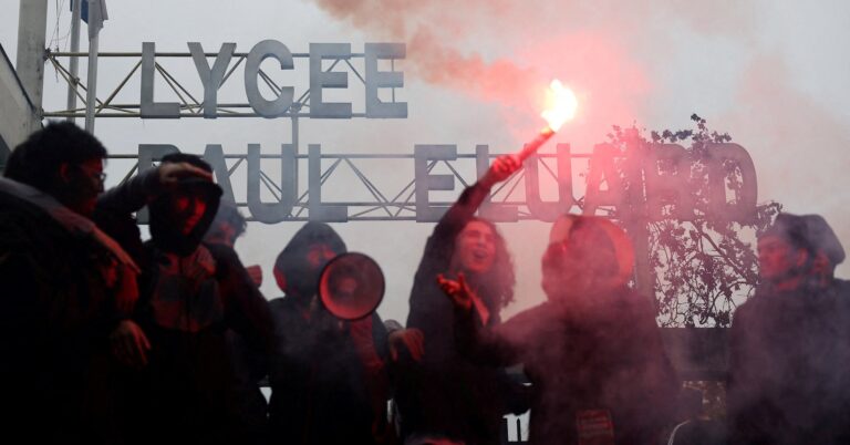 French high school students block the access to the Lycee Paul Eluard high school as they protest to demand the hiring of