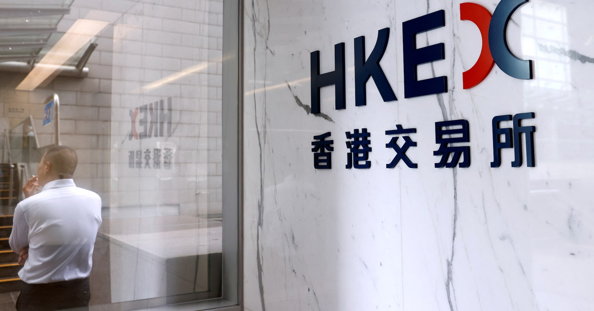 The logo of Hong Kong Exchanges & Clearing Ltd. (HKEX) is seen at the financial Central district in Hong Kong, China