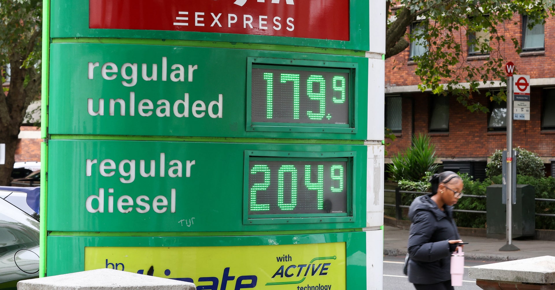 British sterling prices per litre for unleaded and diesel fuel displayed at the entrance to a petrol station in central