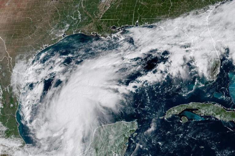 This satellite image from the National Oceanic and Atmospheric Administration shows Tropical Storm Isaias off the eastern